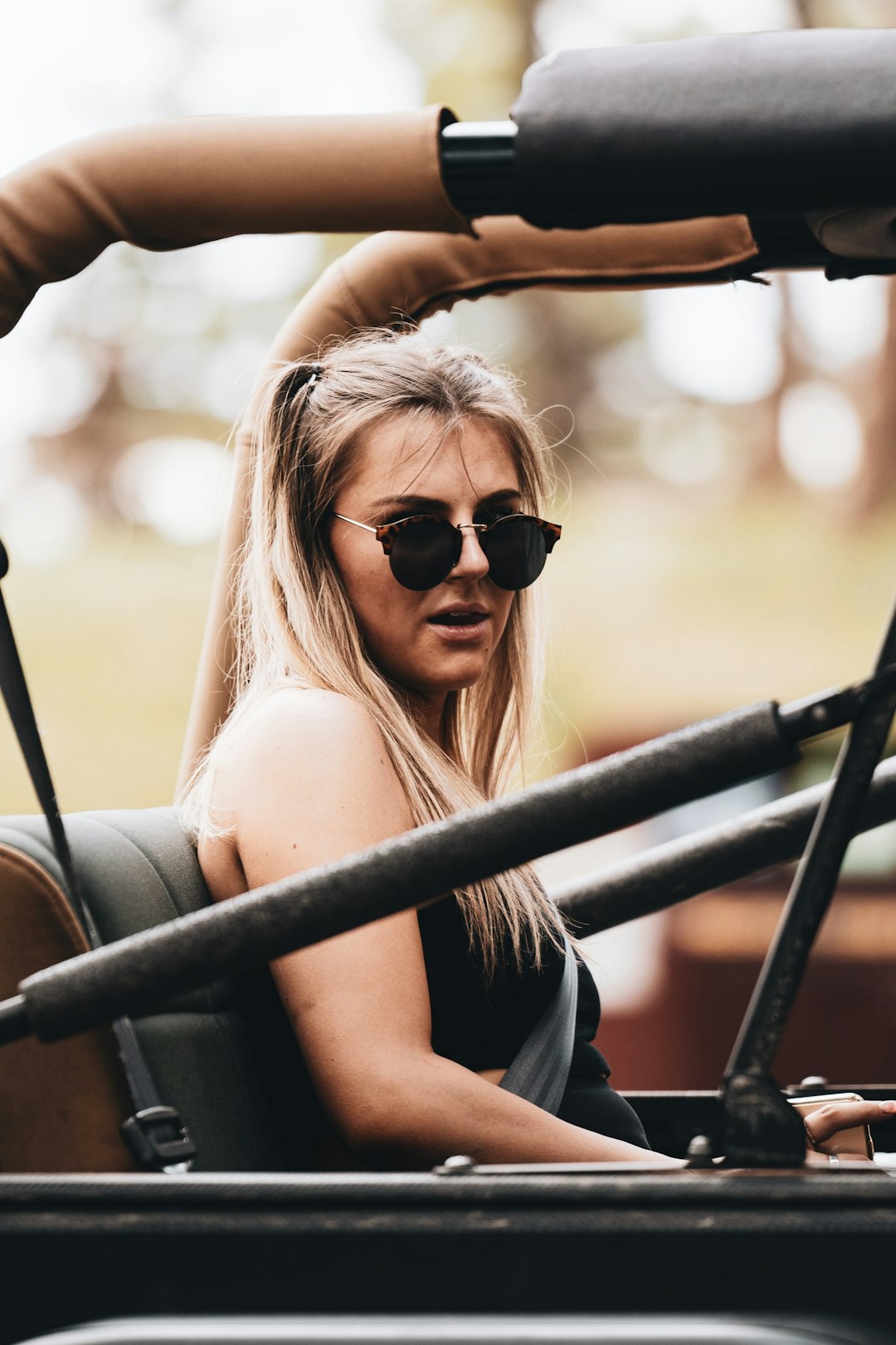 woman in black tank top wearing black sunglasses