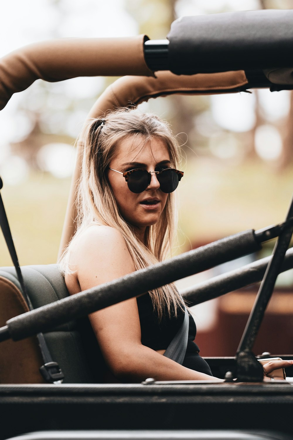 woman in black tank top wearing black sunglasses