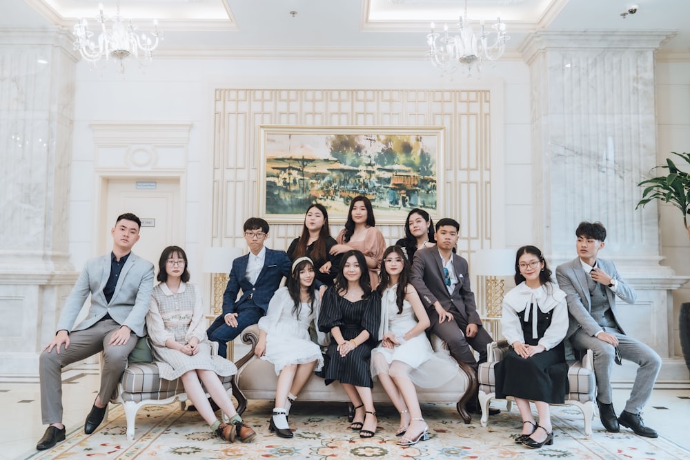 group of people sitting on chair