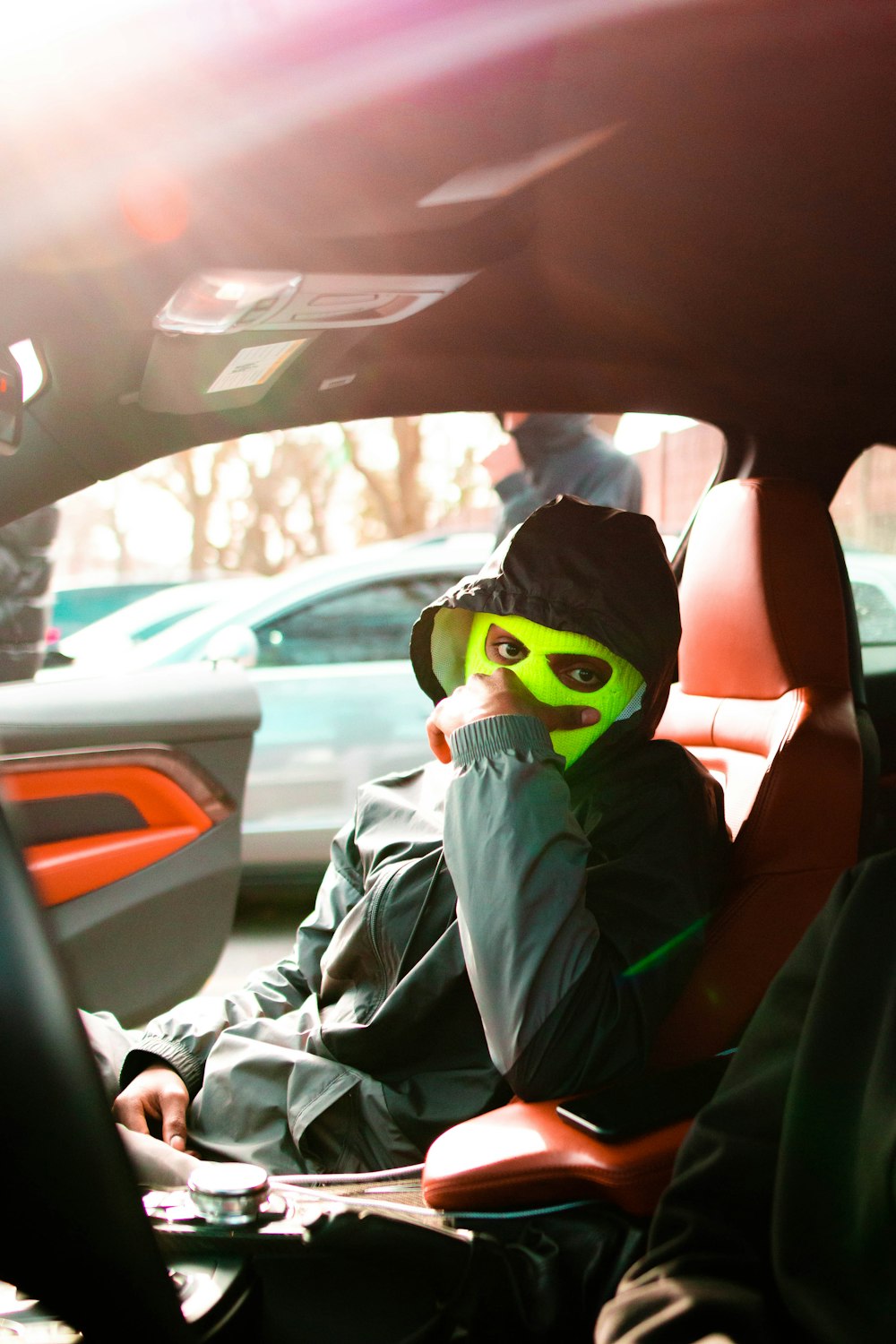 boy in gray hoodie wearing green mask