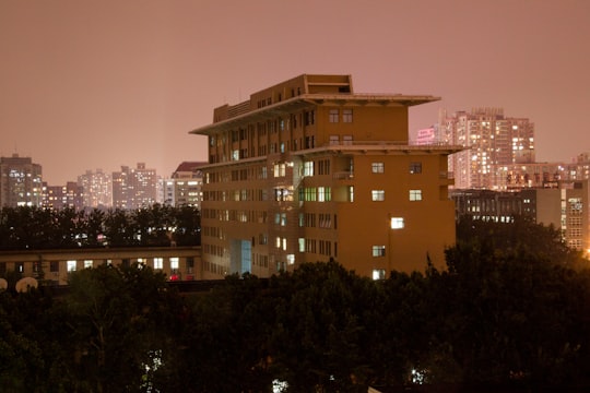 brown concrete building during night time in Beijing Language and Culture University China