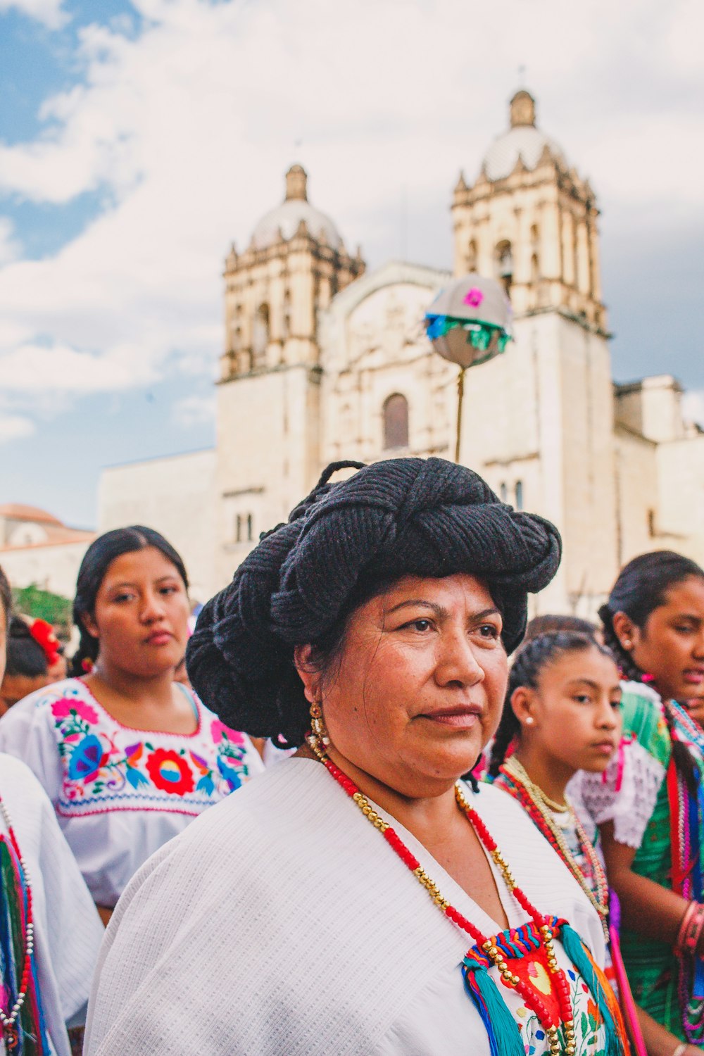 people in white shirt and black hat