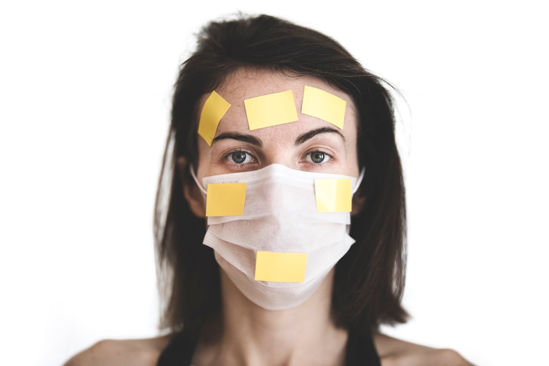 girl wearing a coronavirus mask and yellow sticker