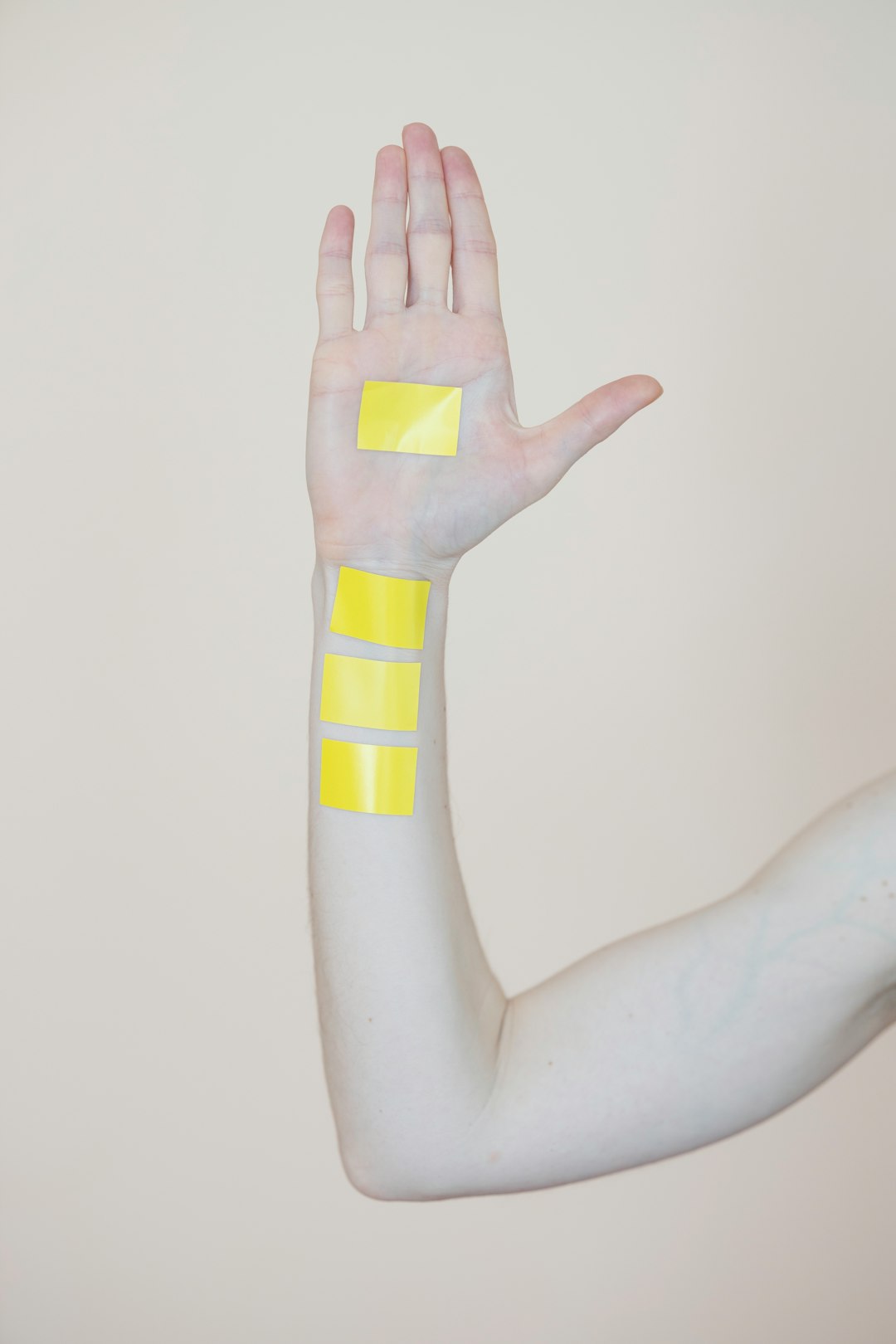person holding yellow and white cross