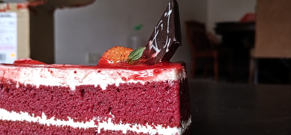 strawberry cake on black plate