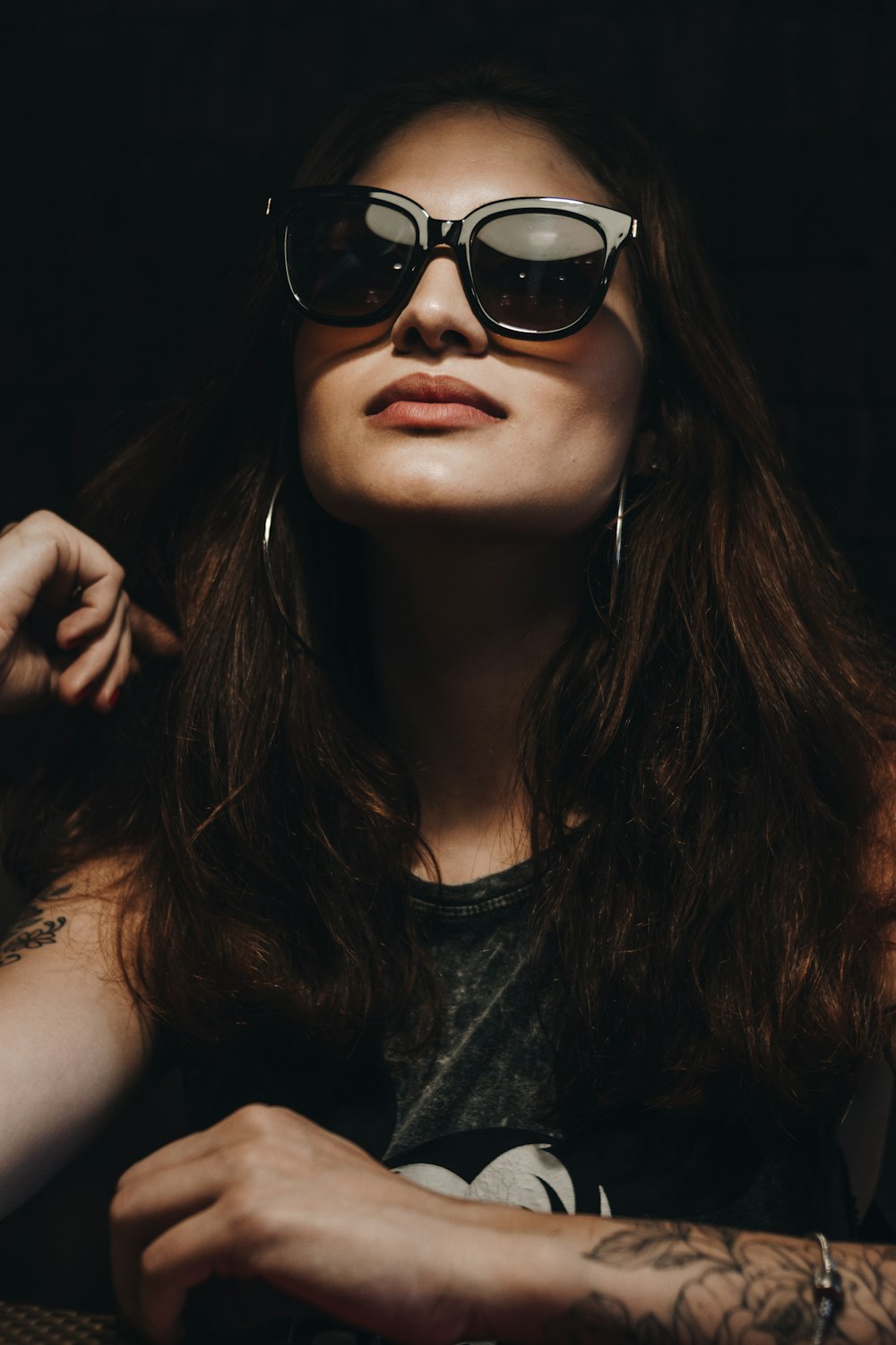 woman in black tank top wearing black sunglasses