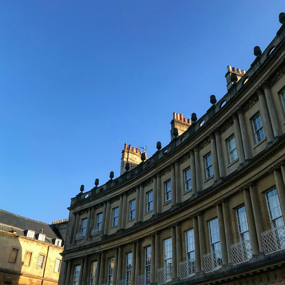 brown concrete building under blue sky during daytime