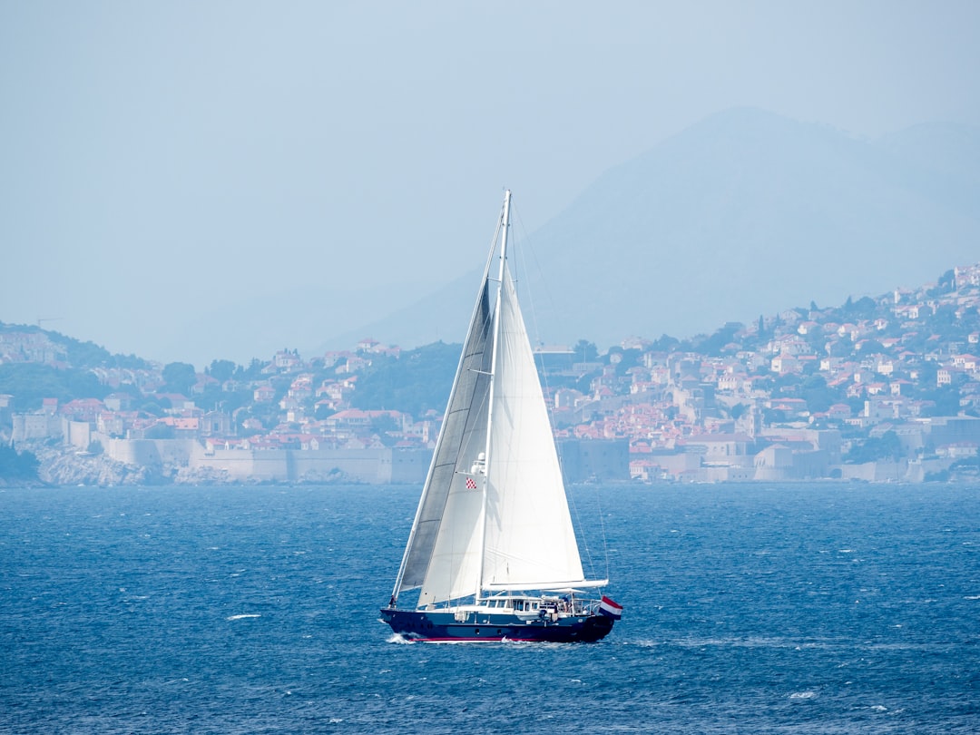 white sailboat on sea during daytime