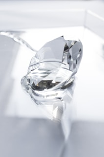 clear crystal on white surface