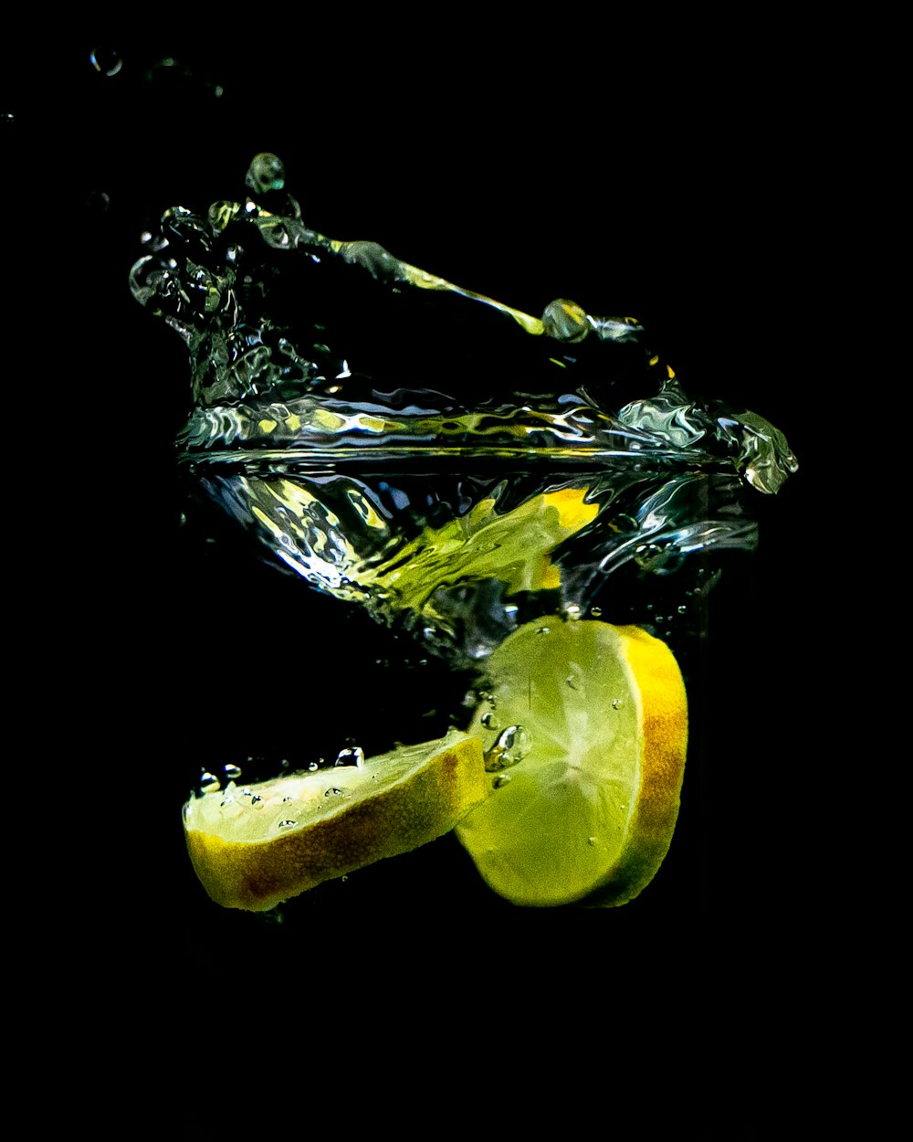 sliced lemon in clear glass container