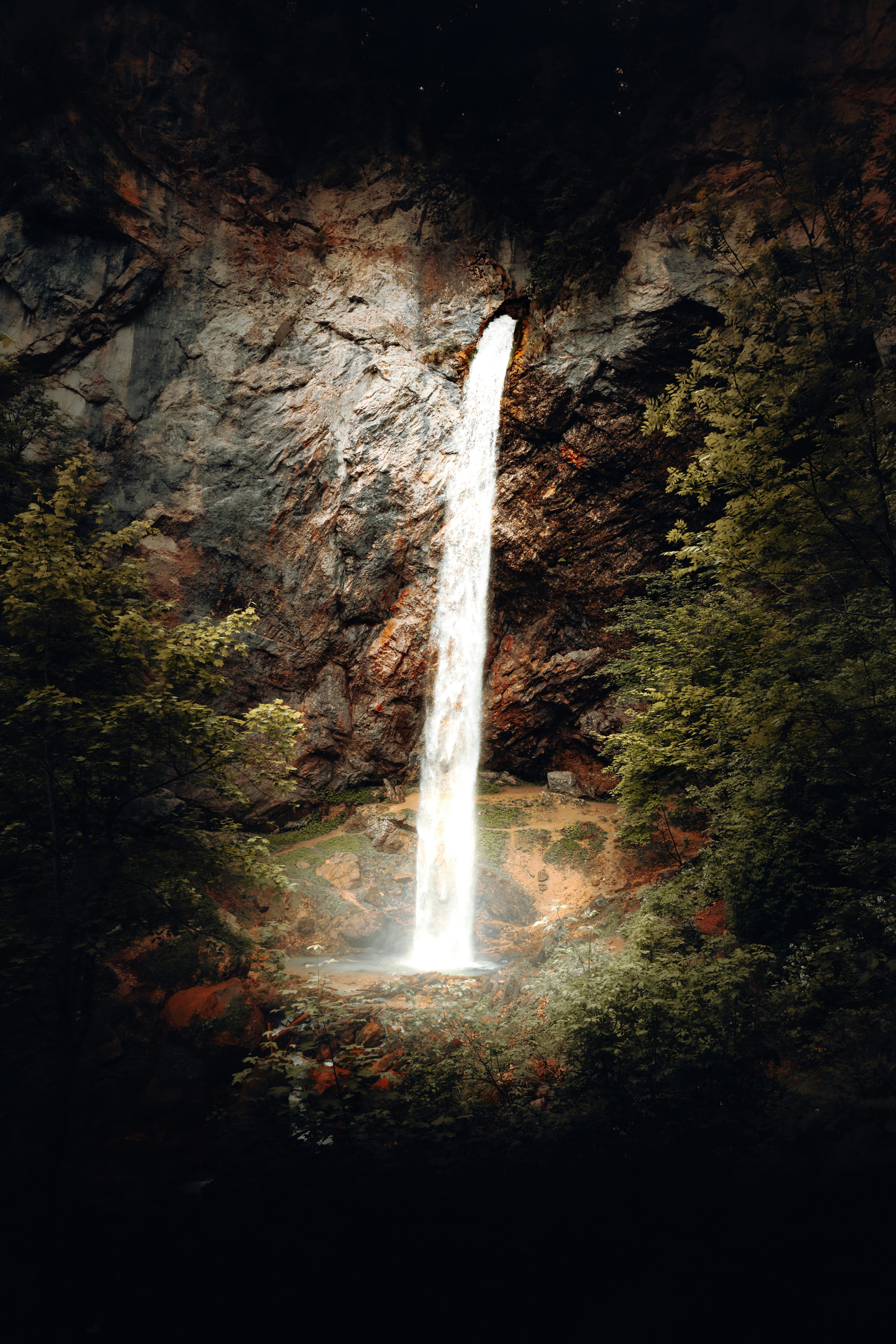 waterfalls in the middle of the forest