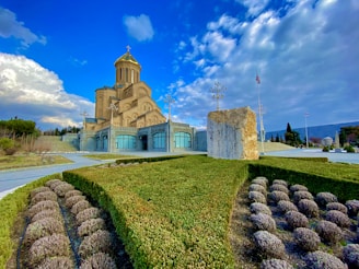 brown concrete building under blue sky during daytime