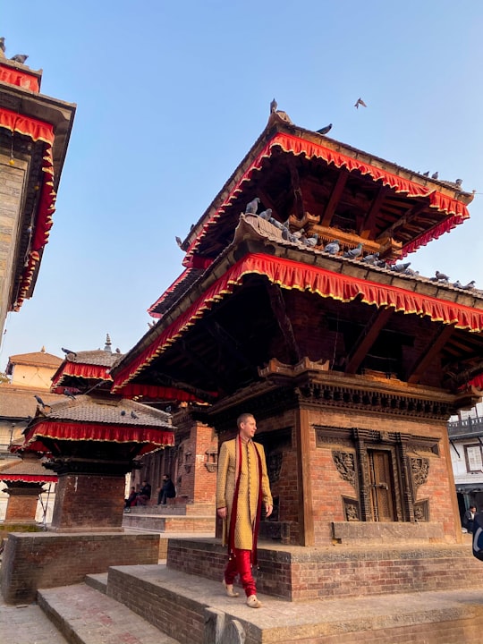 brown concrete building under blue sky during daytime in Kathmandu Durbar Square Nepal