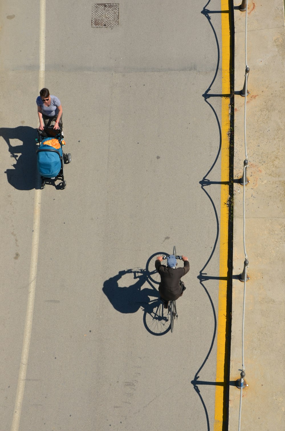 man in blue shirt riding bicycle