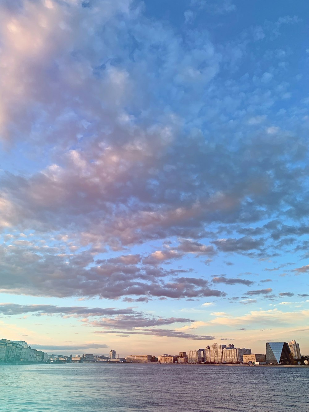 white and blue cloudy sky over city