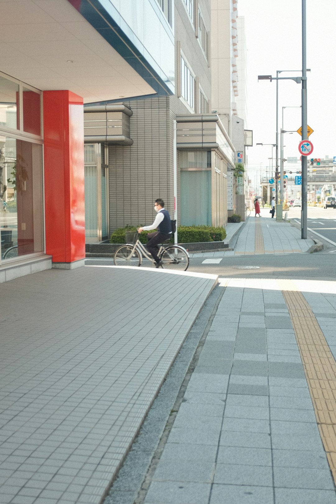 man in black t-shirt riding bicycle on street during daytime