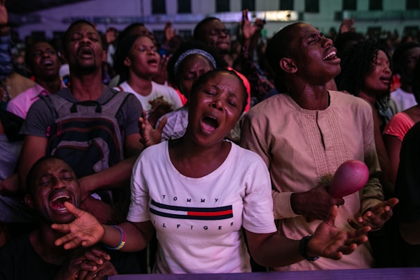 man in white crew neck t-shirt smiling