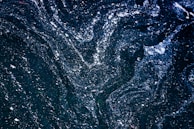 A whimsical pattern featuring hand-drawn stars and moons, evoking a dreamy, hopeful night sky.