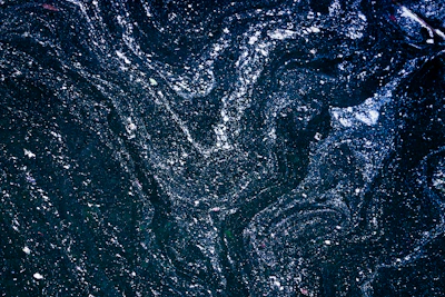 A modern, minimalist digital pattern showcasing delicate constellation designs against a deep charcoal background.