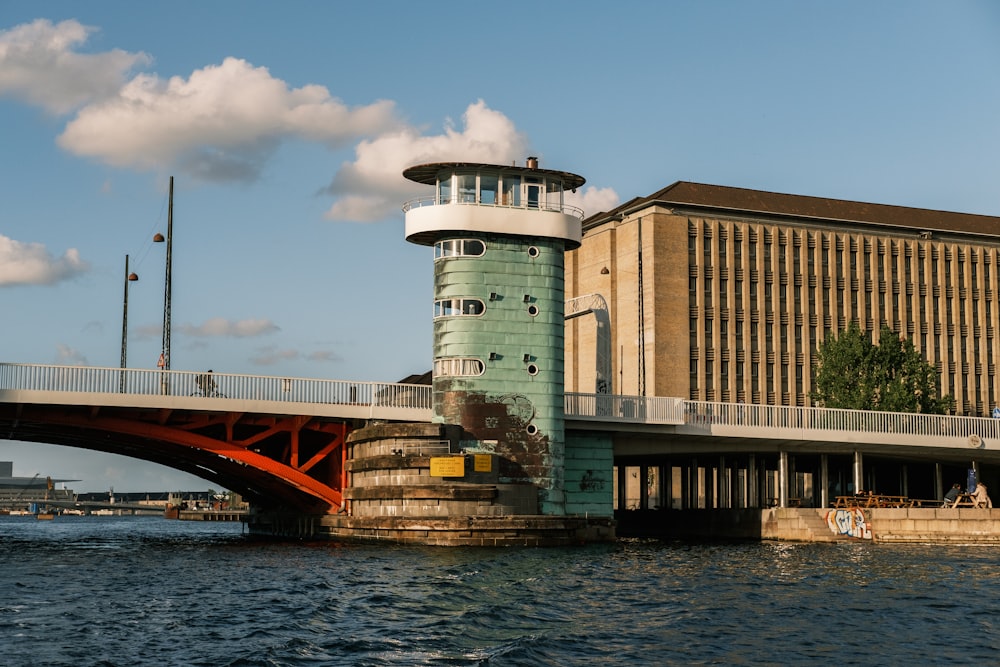 brown concrete building near body of water during daytime