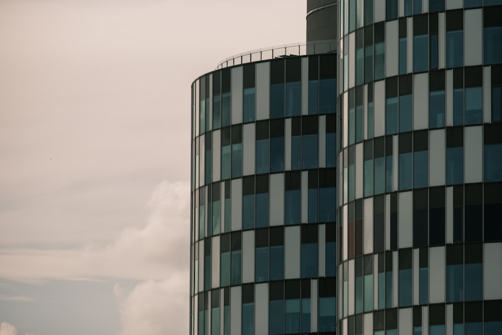 blue and gray concrete building under white clouds