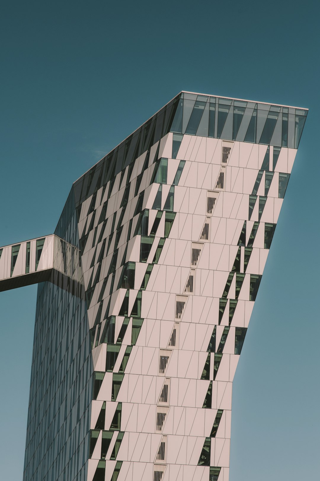 white and black concrete building under blue sky during daytime