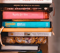 books on brown wooden shelf