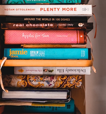 books on brown wooden shelf