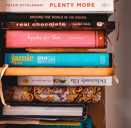 books on brown wooden shelf