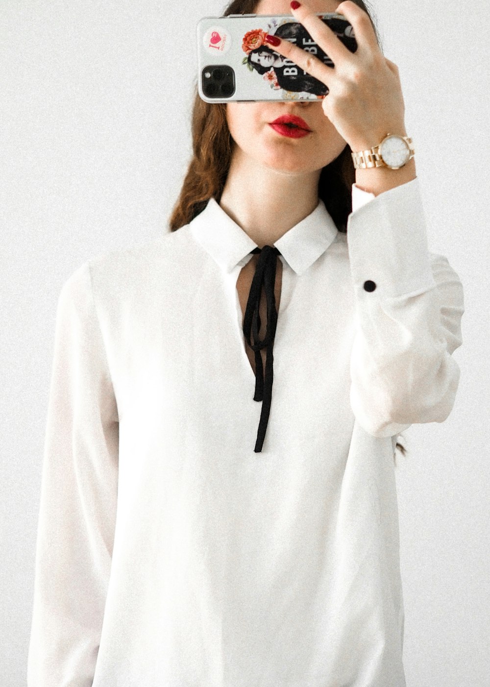 woman in white blazer wearing black framed eyeglasses