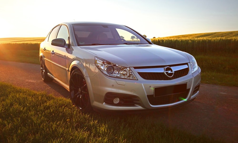 brown mercedes benz c class on green grass field during daytime