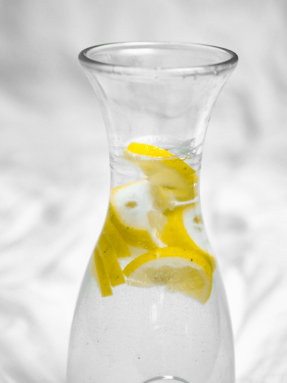 yellow liquid in clear glass bottle