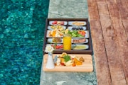black and brown rectangular tray on brown wooden table