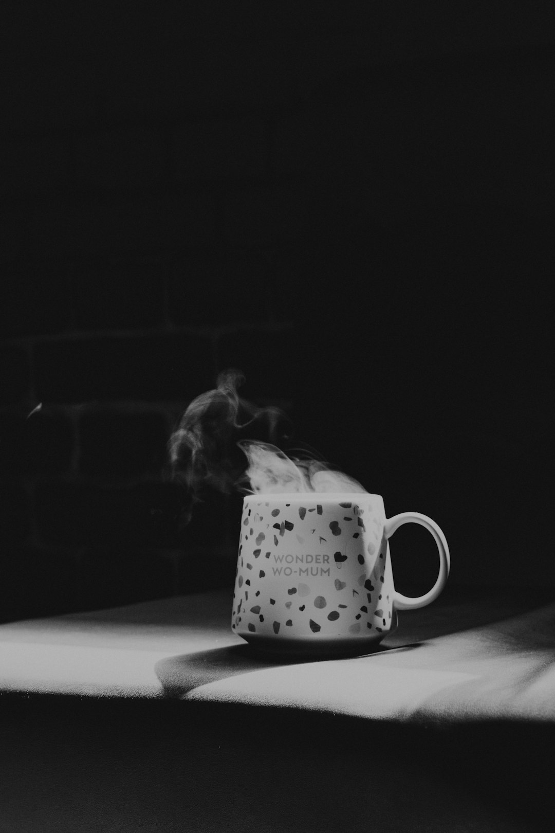 grayscale photo of white ceramic mug