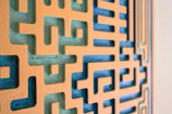 Close-up of a maze puzzle page with warm terracotta and mustard yellow accents.