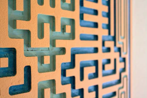 Close-up of a maze puzzle page with warm terracotta and mustard yellow accents.