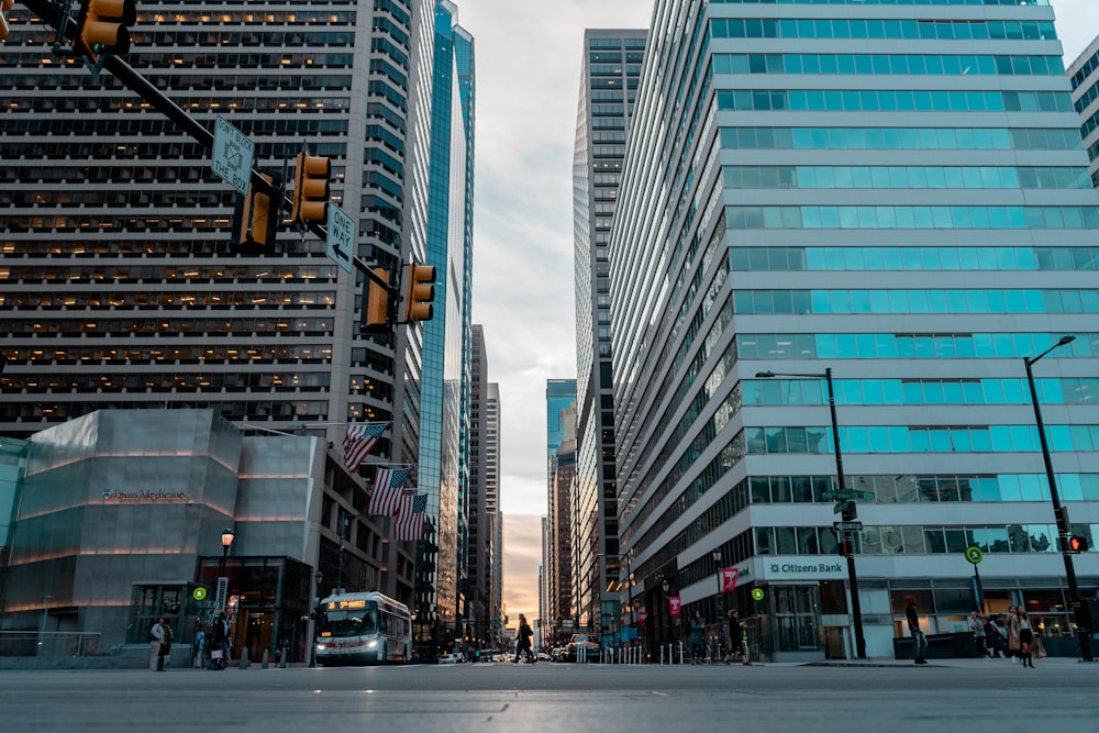 cars on road near high rise buildings during daytime