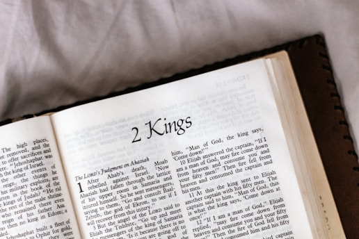 white book page on brown textile