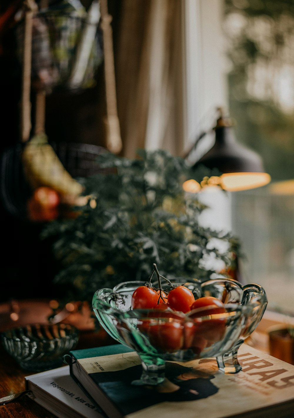 red tomatoes in clear glass bowl