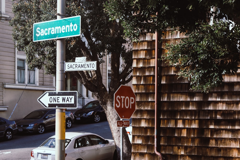 stop sign on brown brick wall