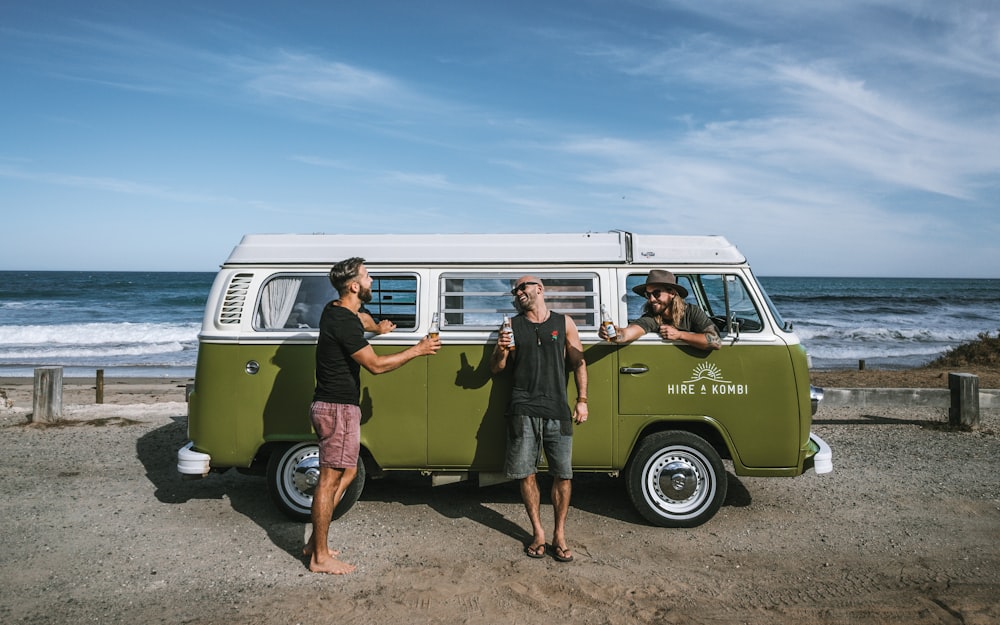 yellow and white van on brown sand during daytime