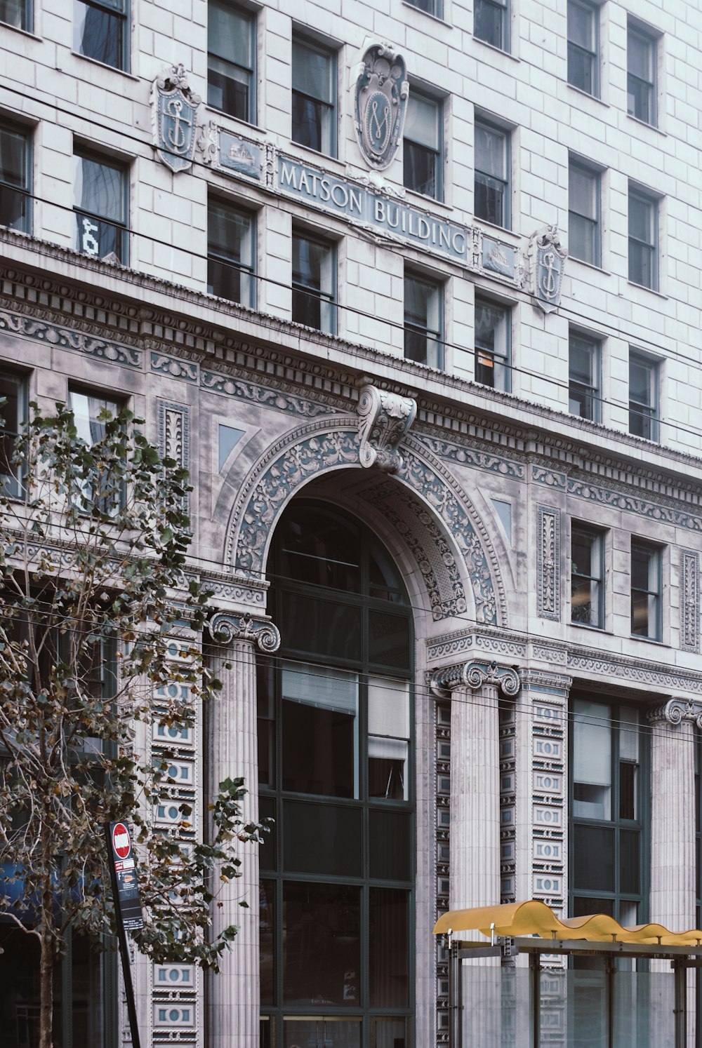 white concrete building with arch shaped window