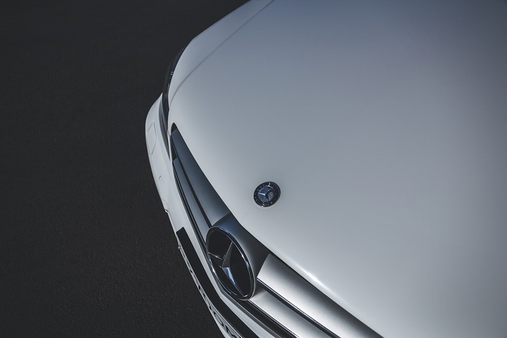 white mercedes benz car on black asphalt road