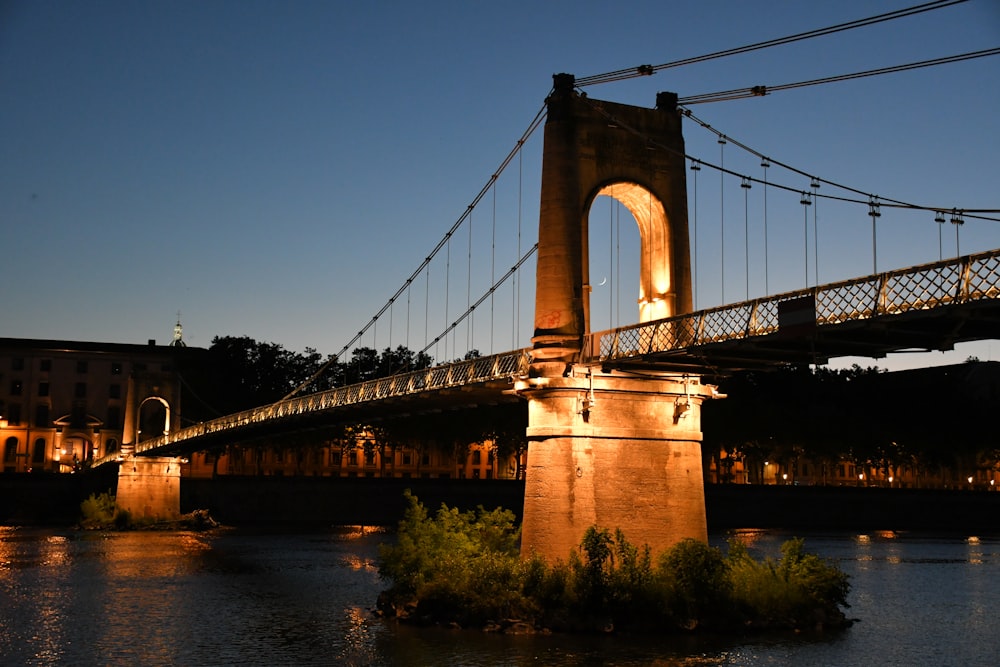 brown bridge over river during night time