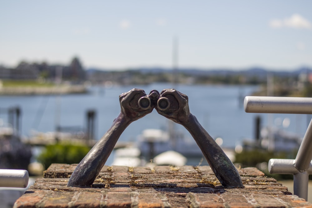 white binoculars on brown wooden table