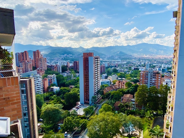 A vibrant city skyline showcasing various apartment buildings.