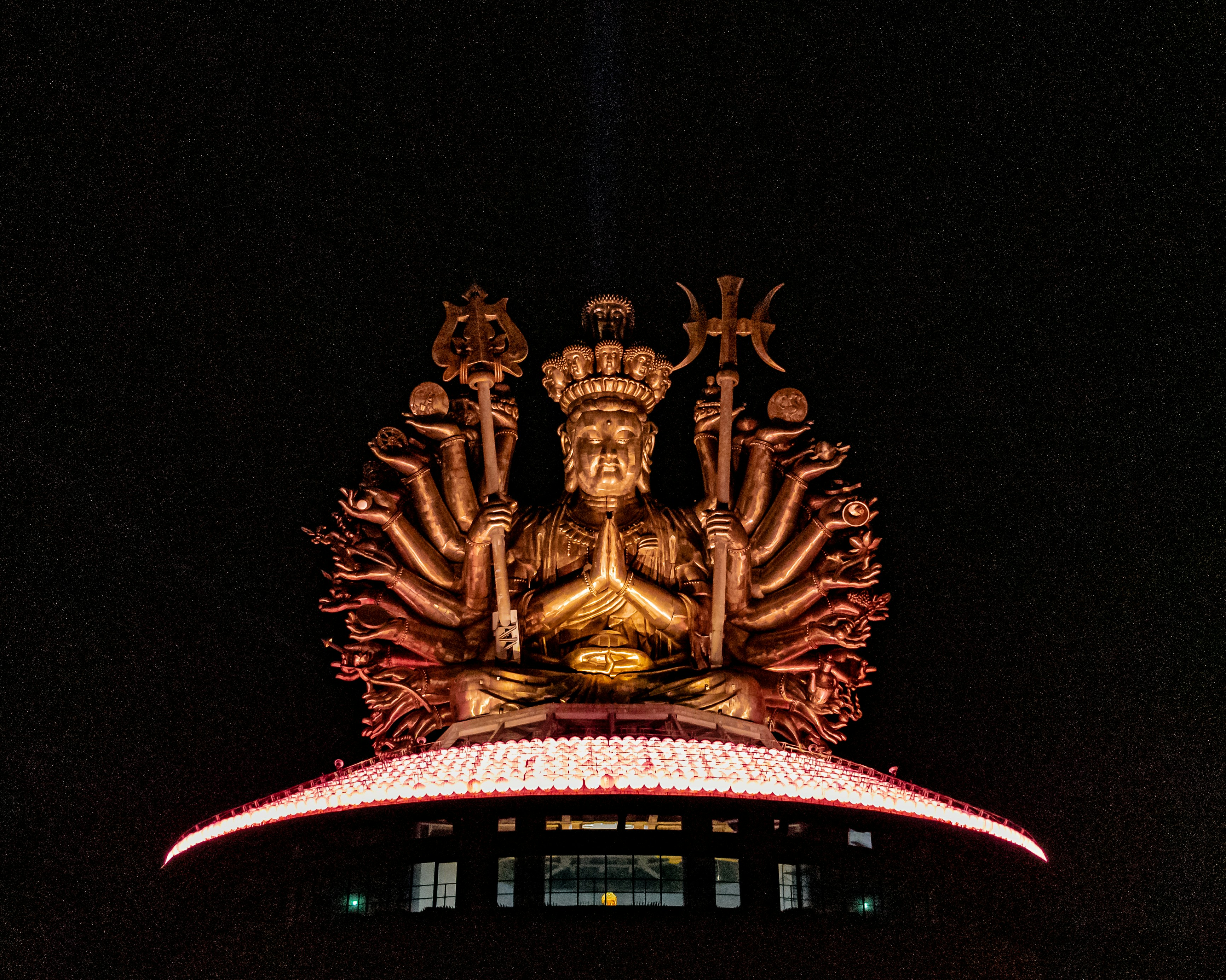 gold dragon statue during night time
