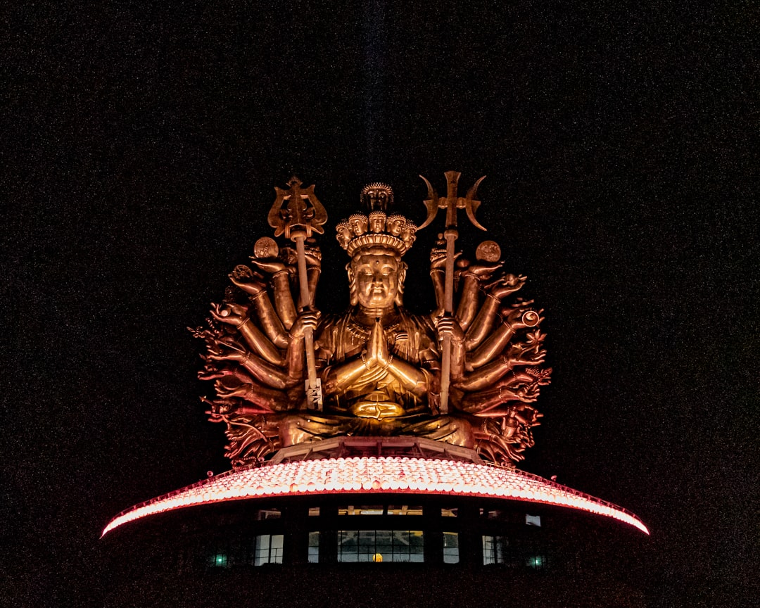 gold dragon statue during night time