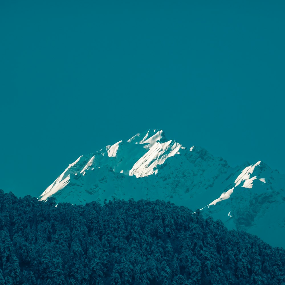 snow covered mountain during daytime