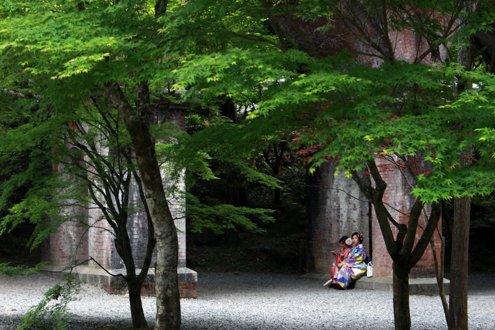 2 children playing on the street during daytime